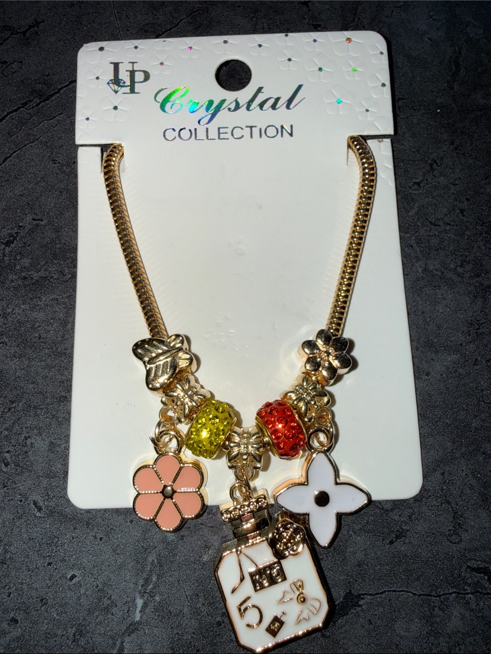 Gold-Tone Floral Charm Bracelet with Pink Flower and Perfume Bottle Charm